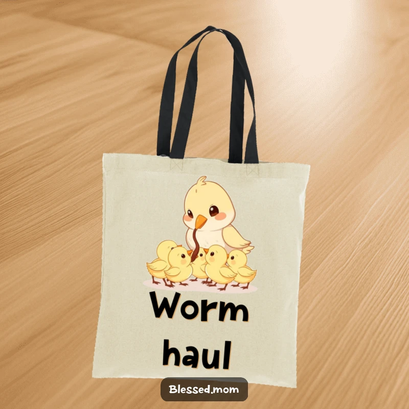 Funny Mama Bird tote bag displays a cute bird feeding a worm to its eager chicks, perfect for moms on the go.